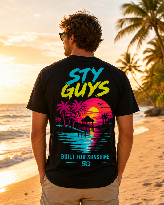 Man wearing the Built for Sunshine tee, Neon colorway, hammock and palms back print