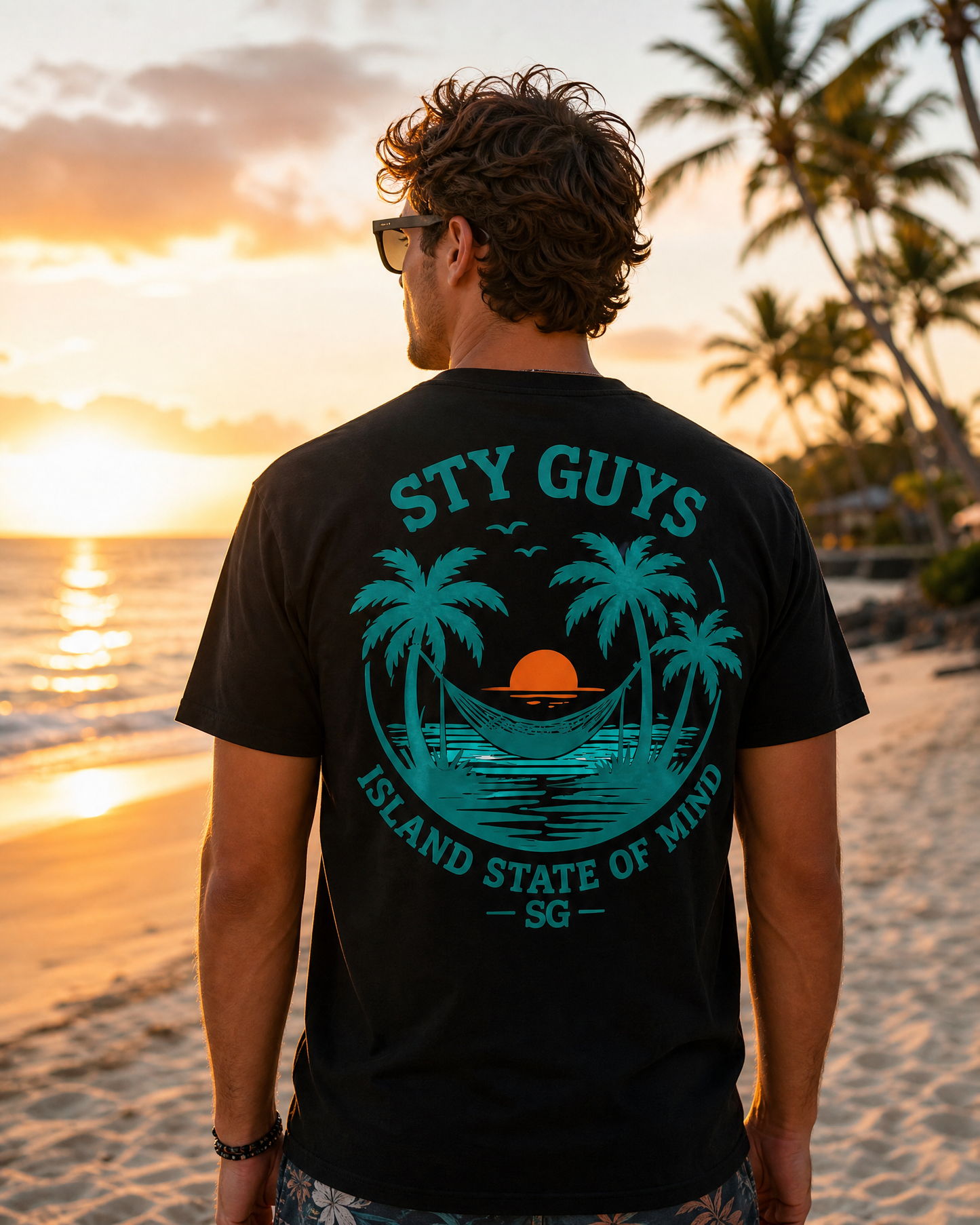 Man wearing the Island State of Mind tee, Neon colorway, sunrise hammock back print