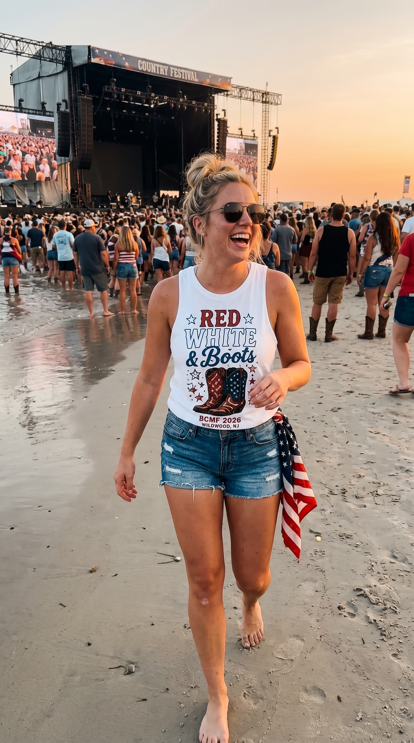 Woman wearing Red White & Boots white tank at the BCMF beach stage at sunset