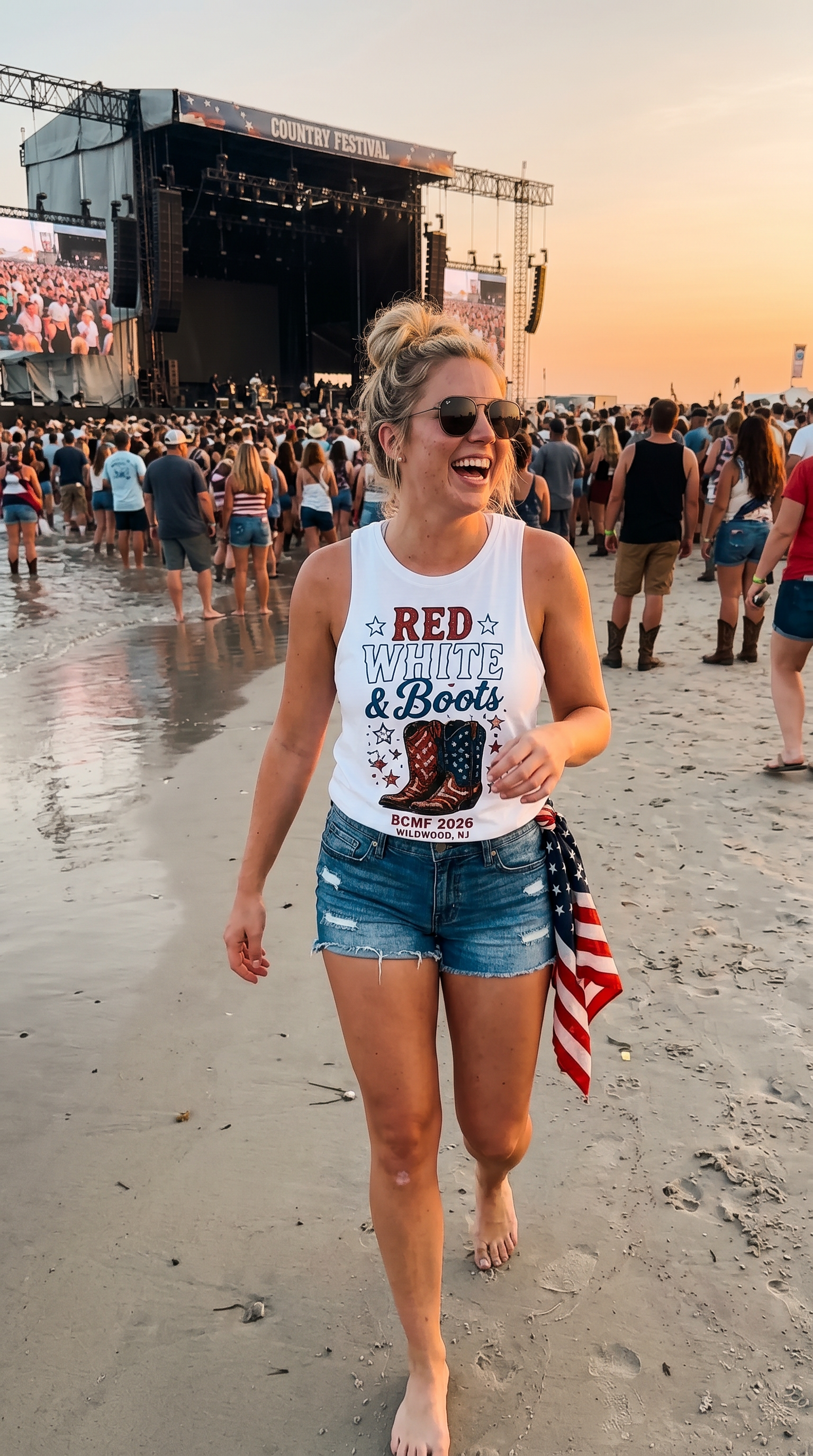 Woman wearing Red White & Boots white tank at the BCMF beach stage at sunset