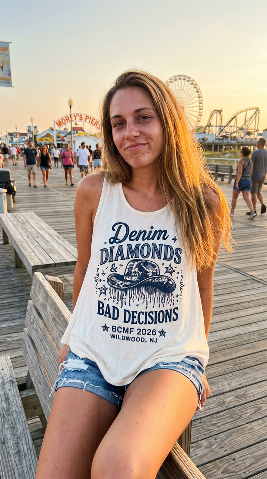 Woman wearing Denim Diamonds & Bad Decisions ivory tank on the Wildwood boardwalk at golden hour